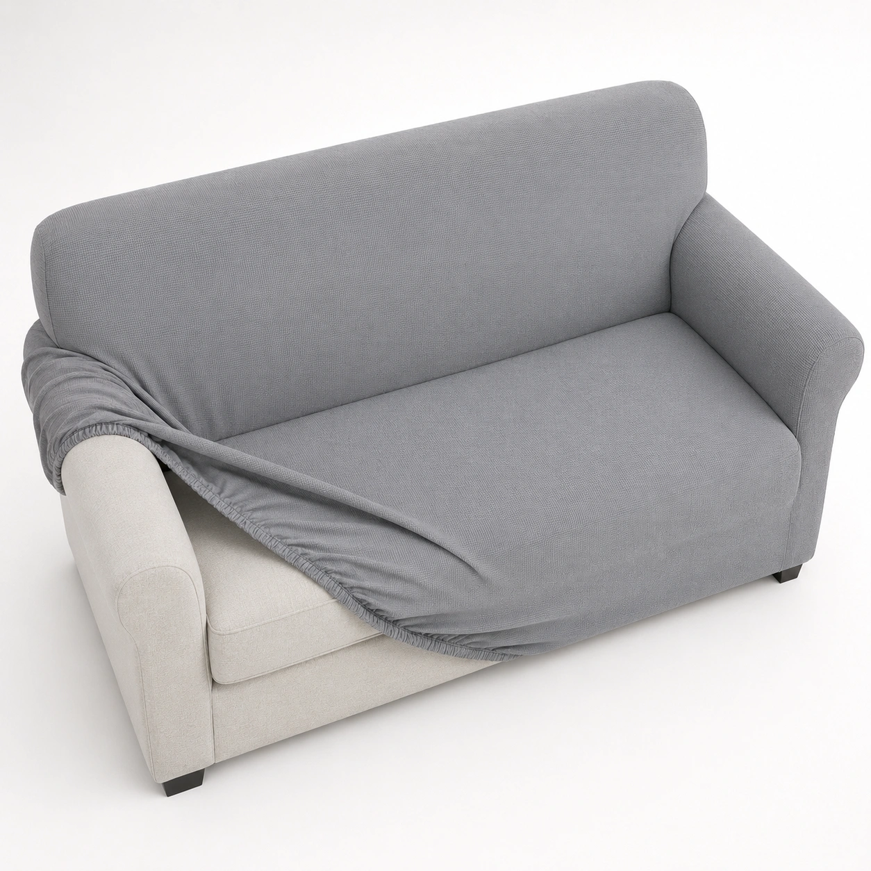 Sofa covers in various colors stretched over a couch