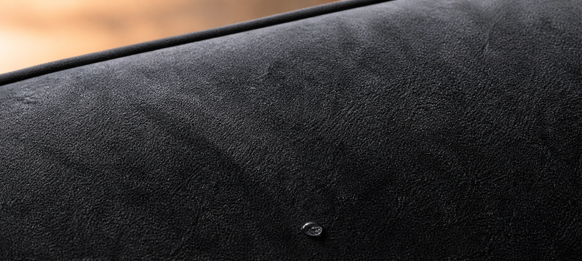 Black microfiber couch in a family living room