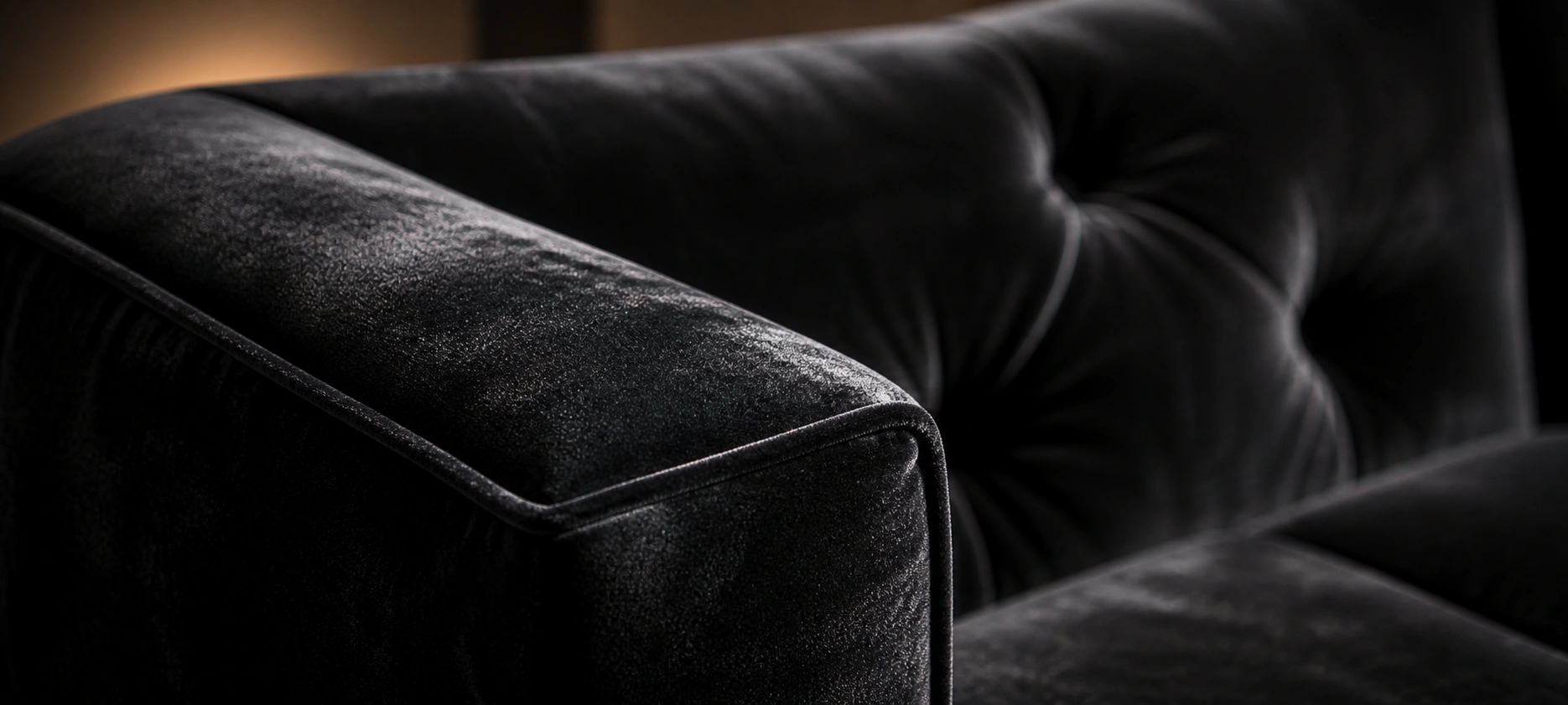 Luxurious black velvet couch in a styled room