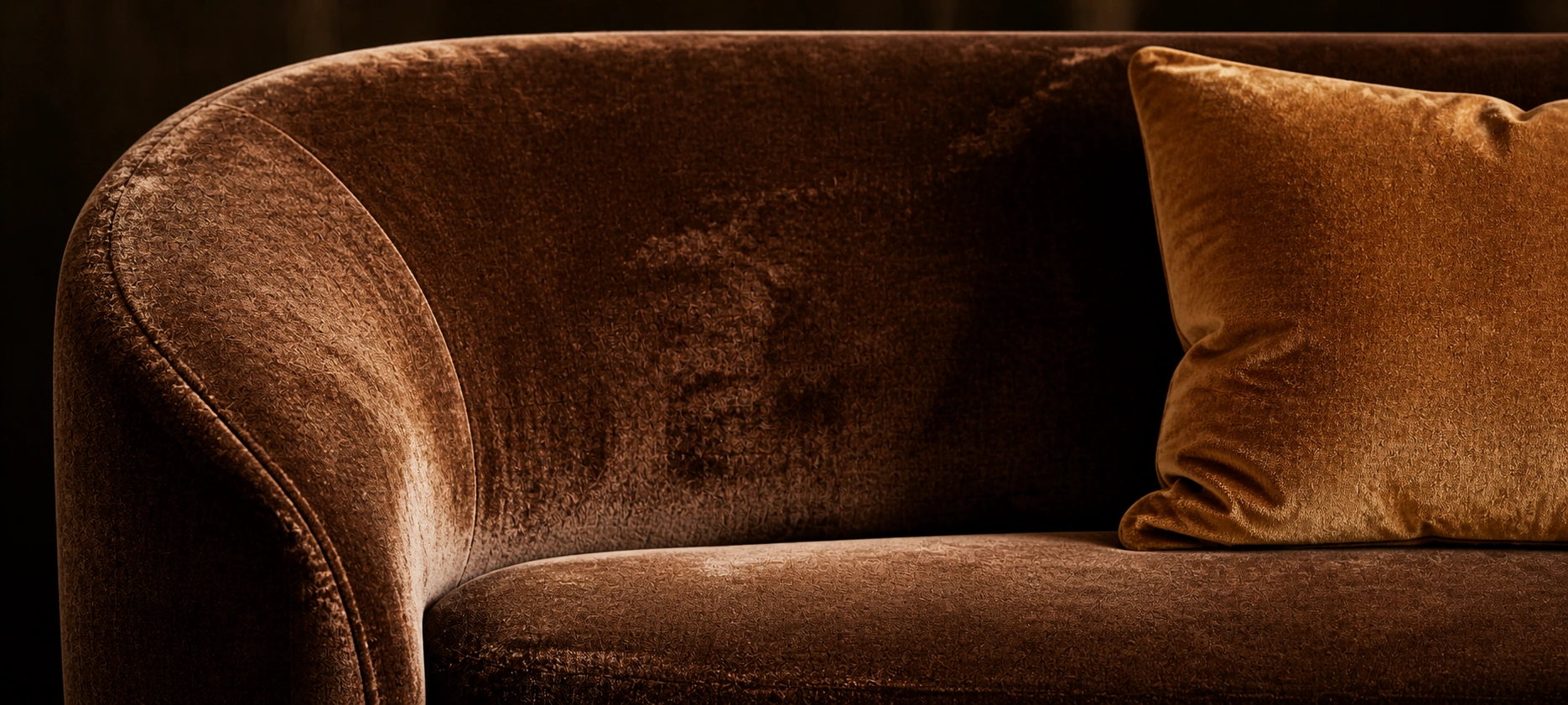 Brown velvet couch with luxurious sheen and plush texture