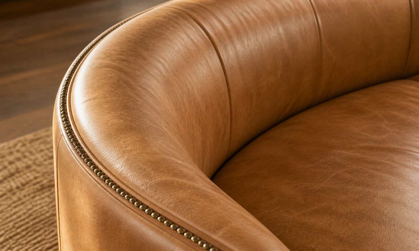 Leather curved sofa in warm tan tone