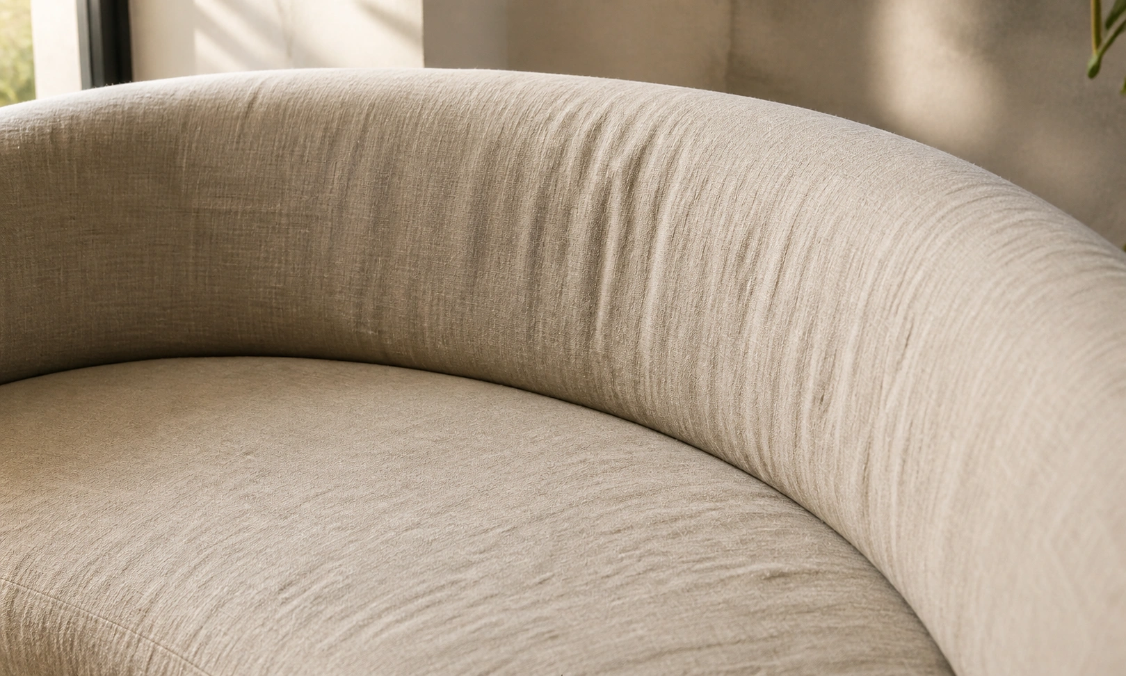 Linen curved sofa in neutral beige tone
