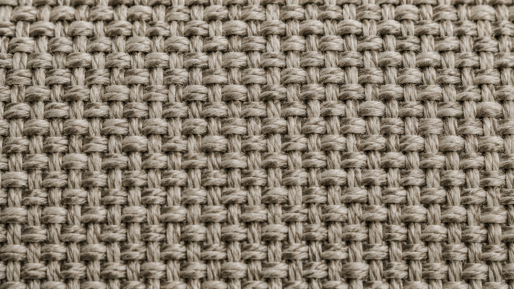 Close-up texture of durable sofa fabric showing tight weave pattern
