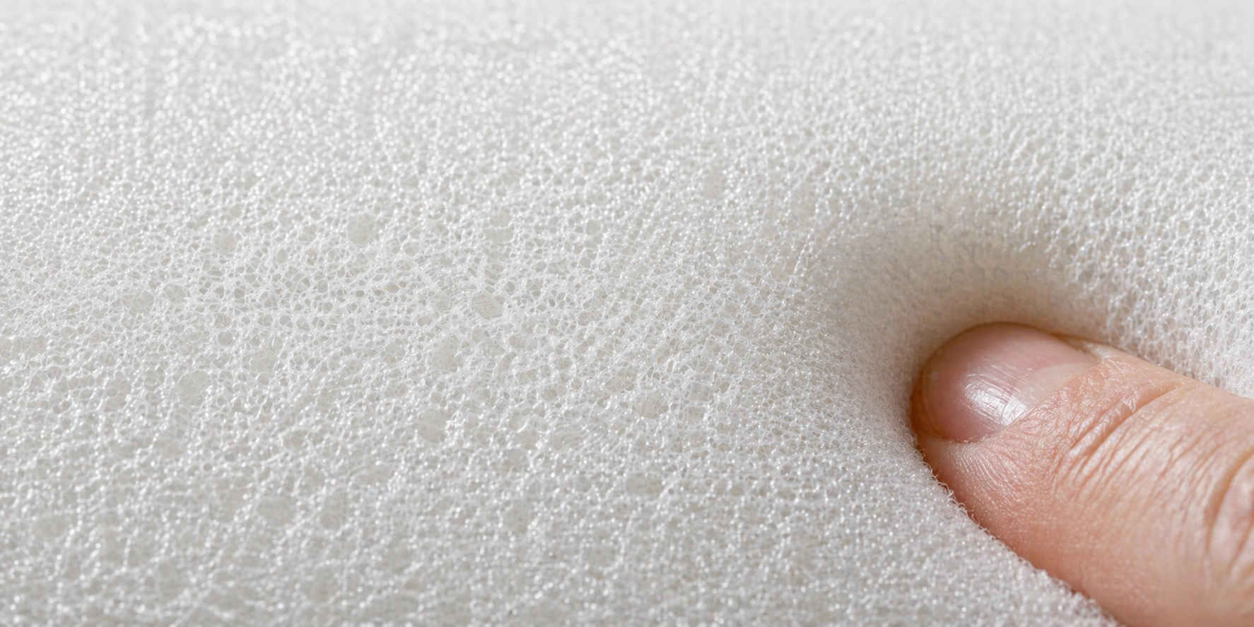 Close-up of high-density foam structure inside a sofa cushion