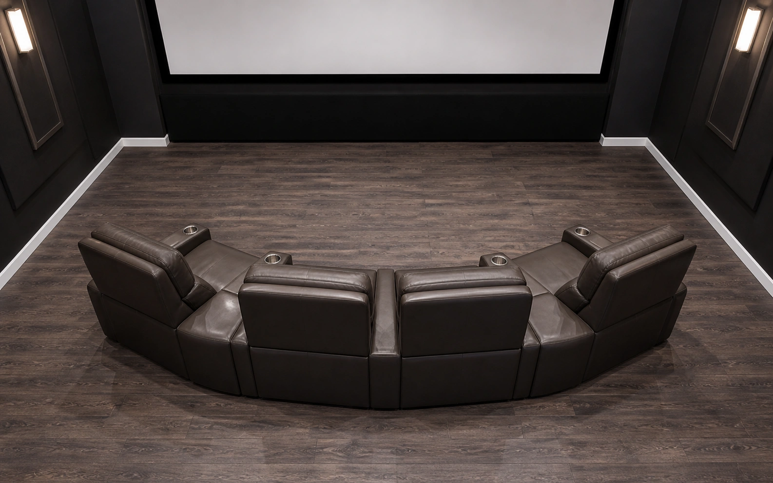 Modular sofa pieces arranged in a curved configuration facing a projection screen