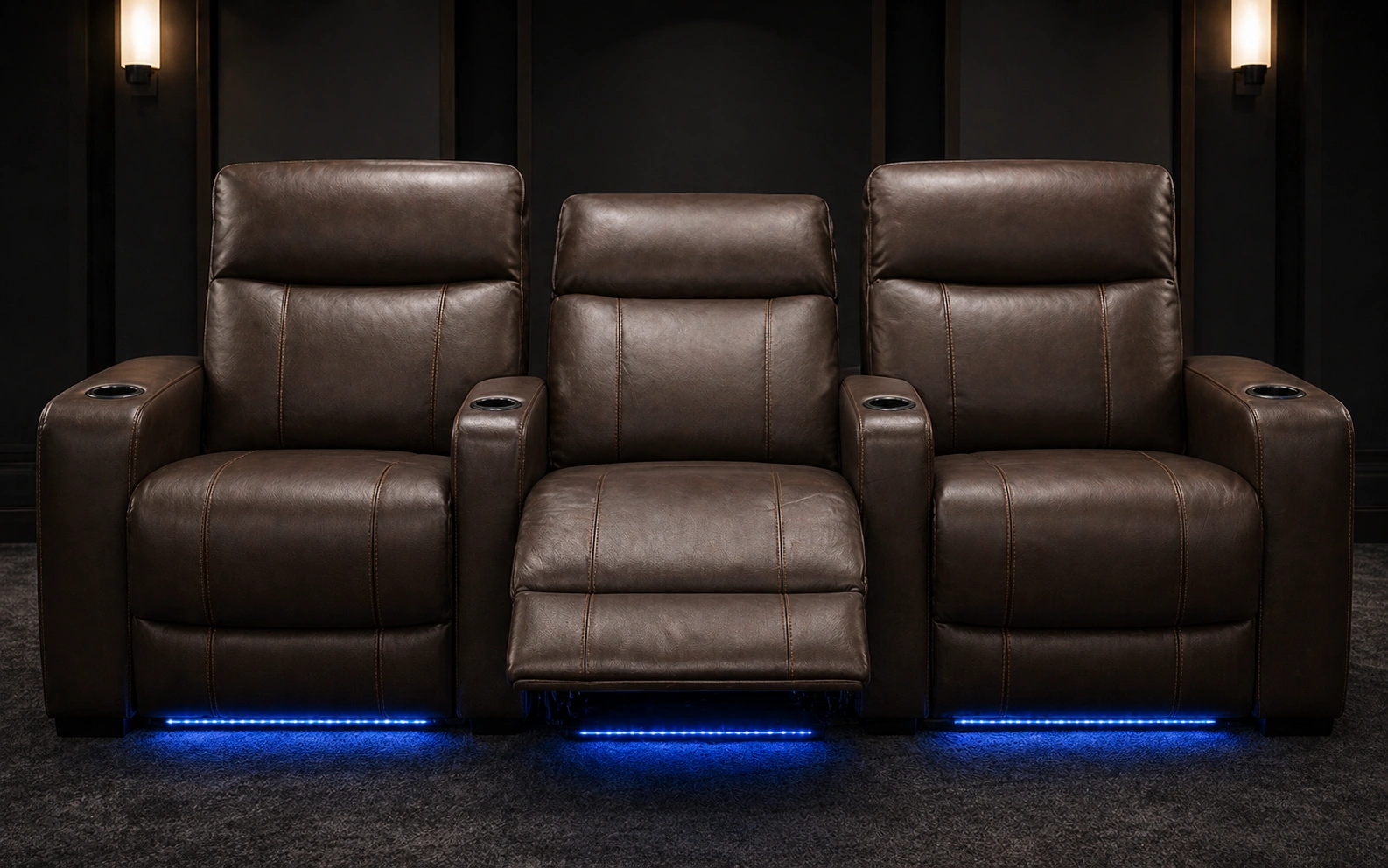 Row of reclining theater sofas with cup holders in a media room