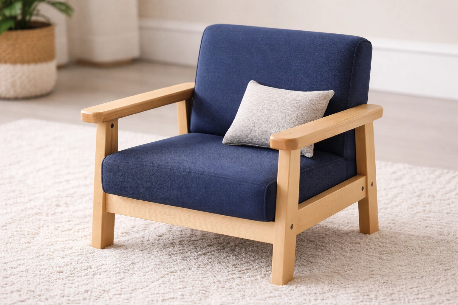 Small kids armchair with solid wooden frame and fabric upholstery