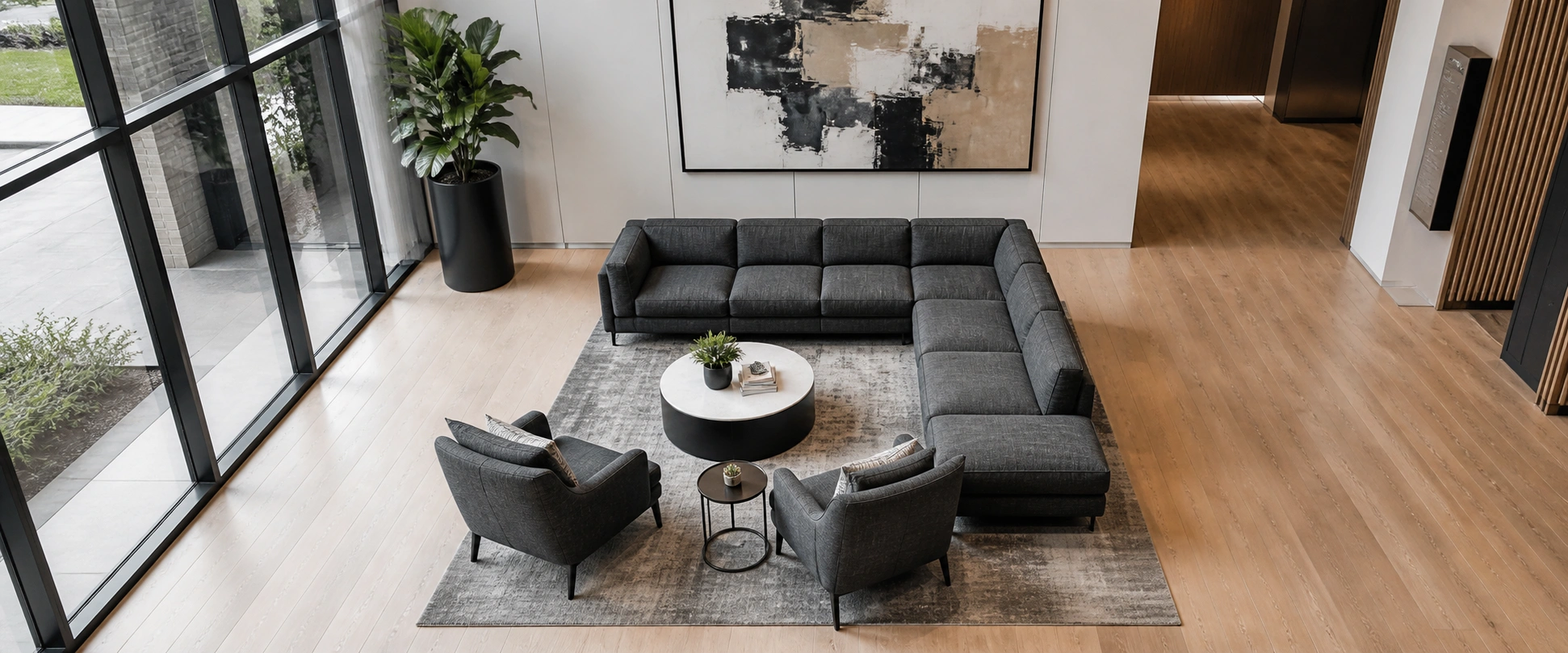 Modern lobby seating arrangement with sectional sofa and accent chairs