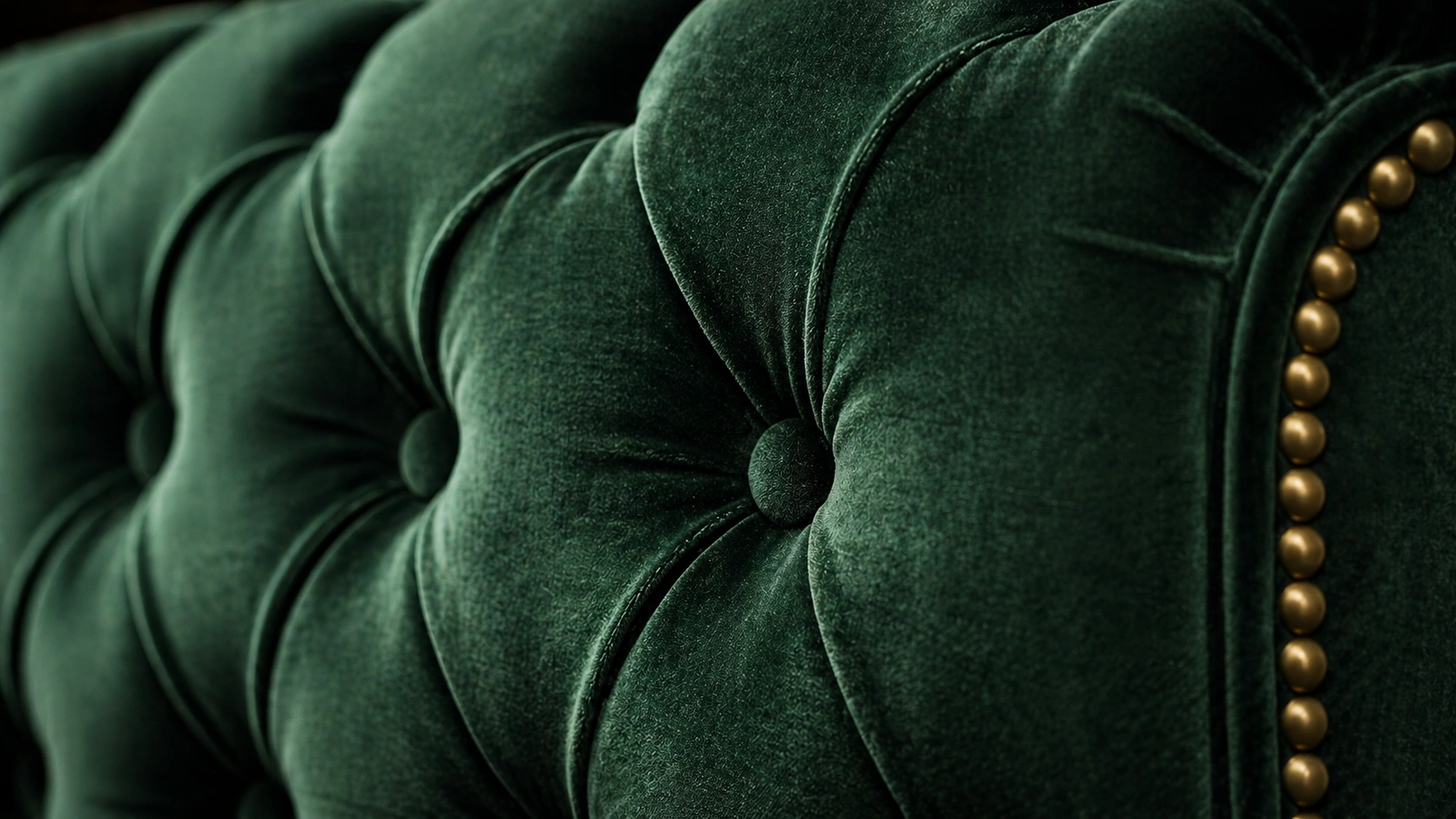 Close-up of handcrafted luxury sofa stitching and tufting detail