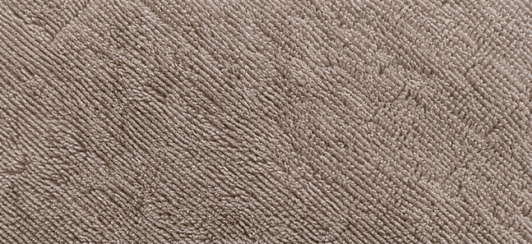 Close-up macro view of microfiber fabric texture showing fine synthetic fibers