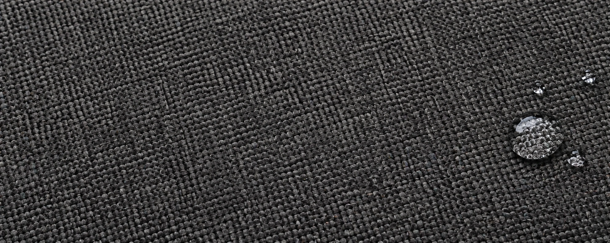 Woven microfiber fabric showing visible thread pattern and structured weave