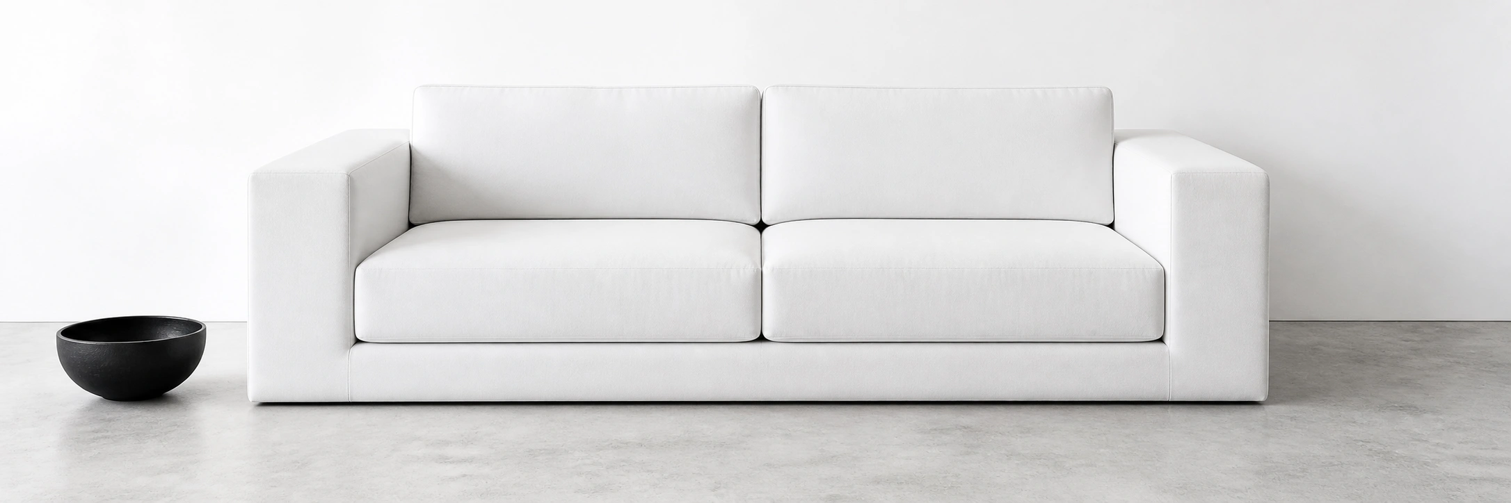 Minimalist modern sofa with ultra-clean lines and neutral fabric