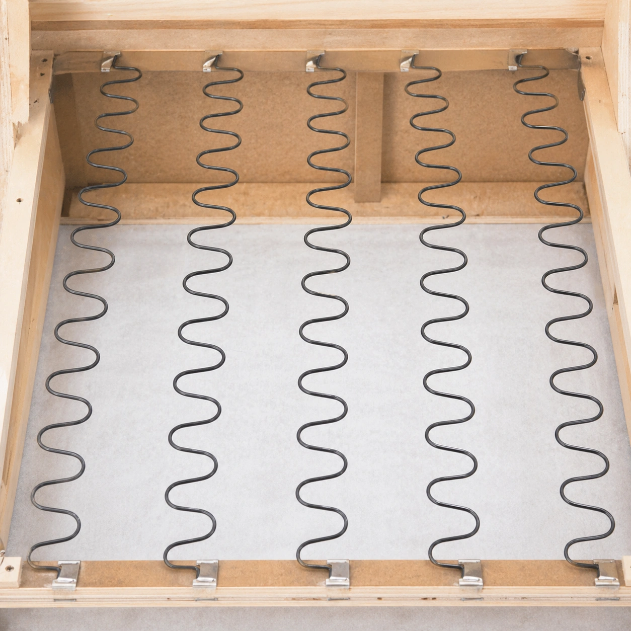 No-sag springs with shaped wires providing firm support in sofa seating