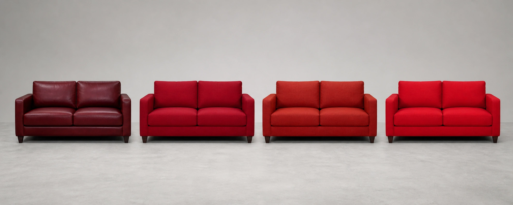 Different shades of red sofas compared side by side from burgundy to cherry