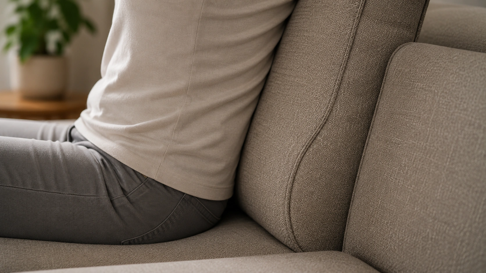 Close-up of lumbar support zone on an ergonomic sofa showing proper curve alignment