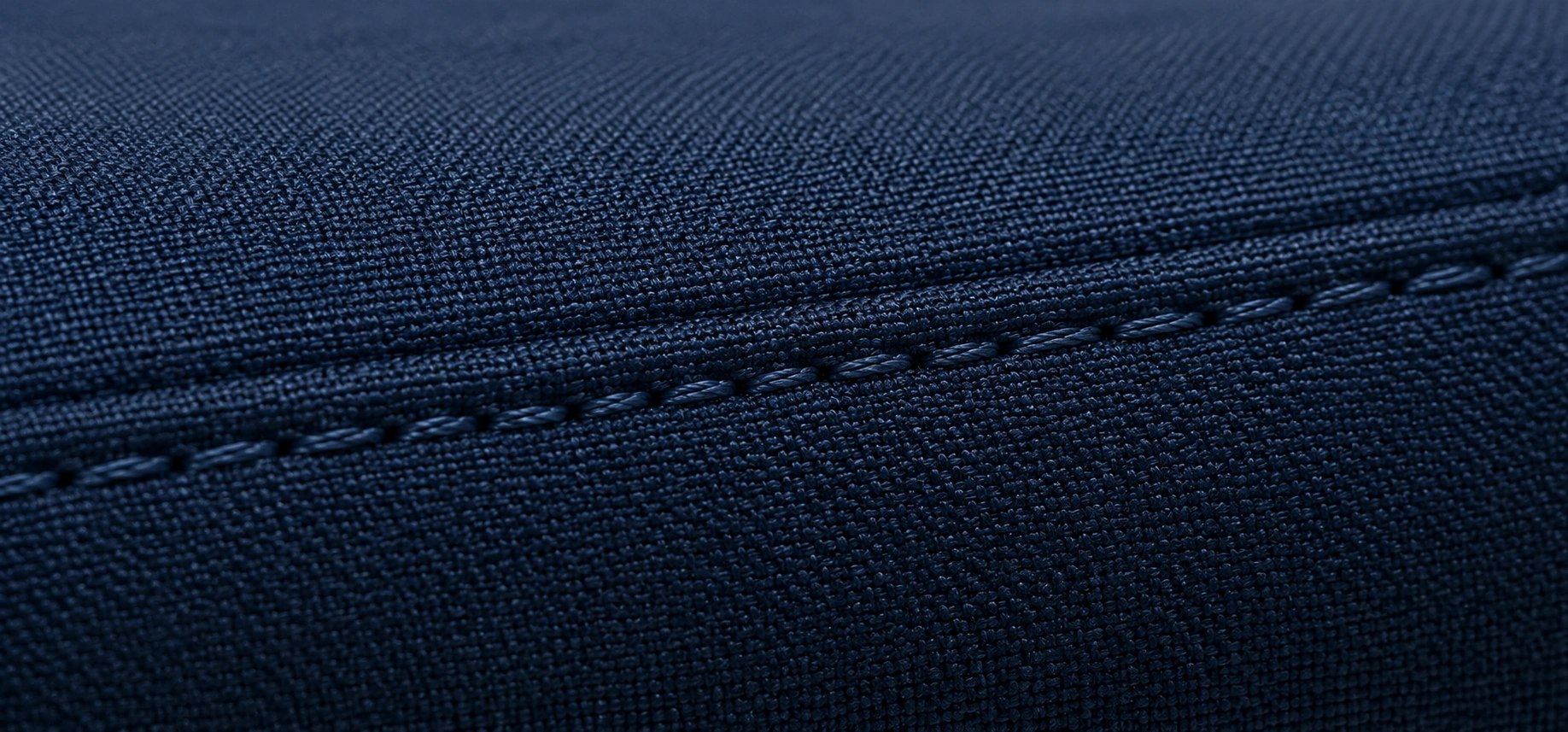 Detailed view of high-quality sofa stitching showing even stitch spacing and clean seams