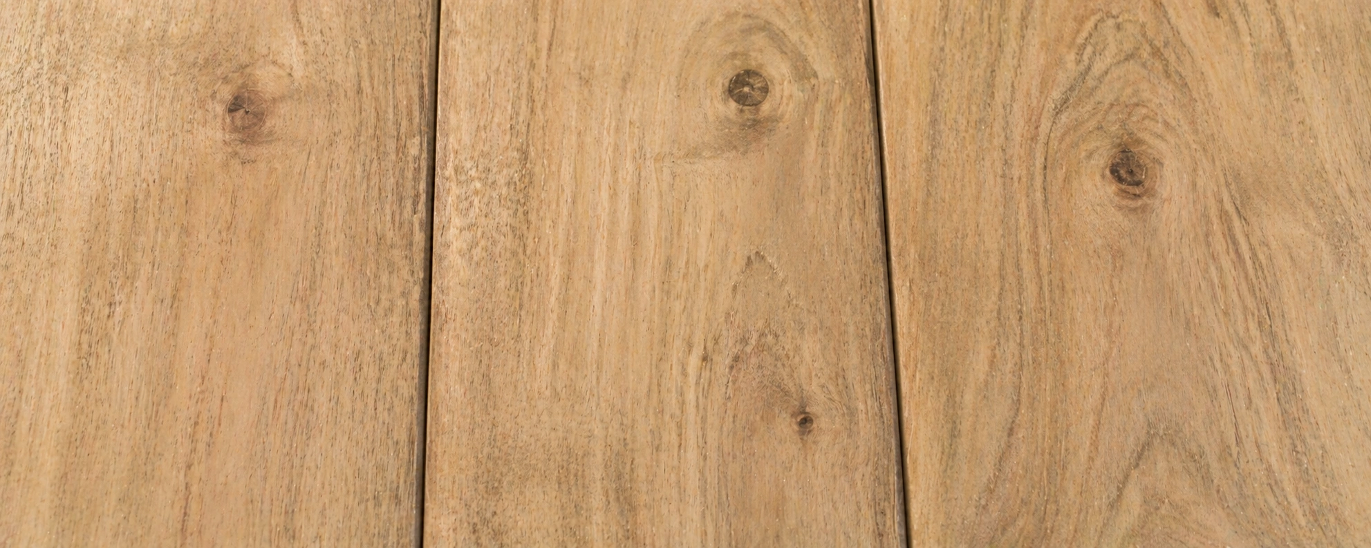 Grade B teak wood showing slightly lighter color with occasional small knots and less uniform grain