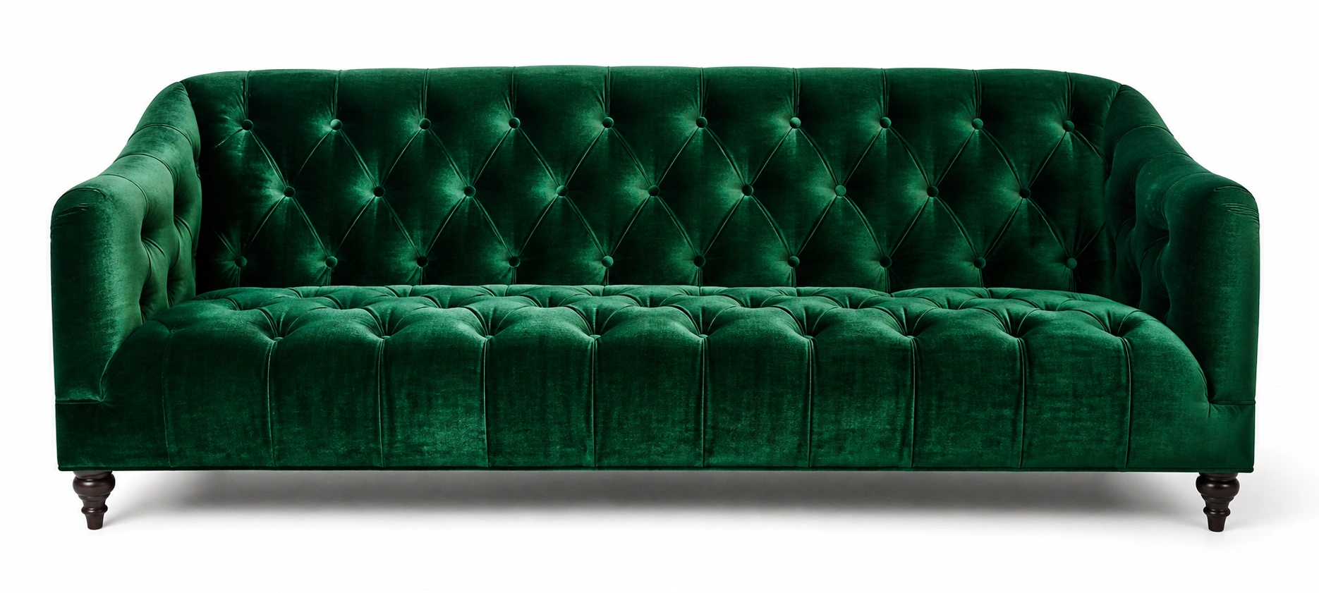 Luxurious velvet tufted sofa in deep emerald green