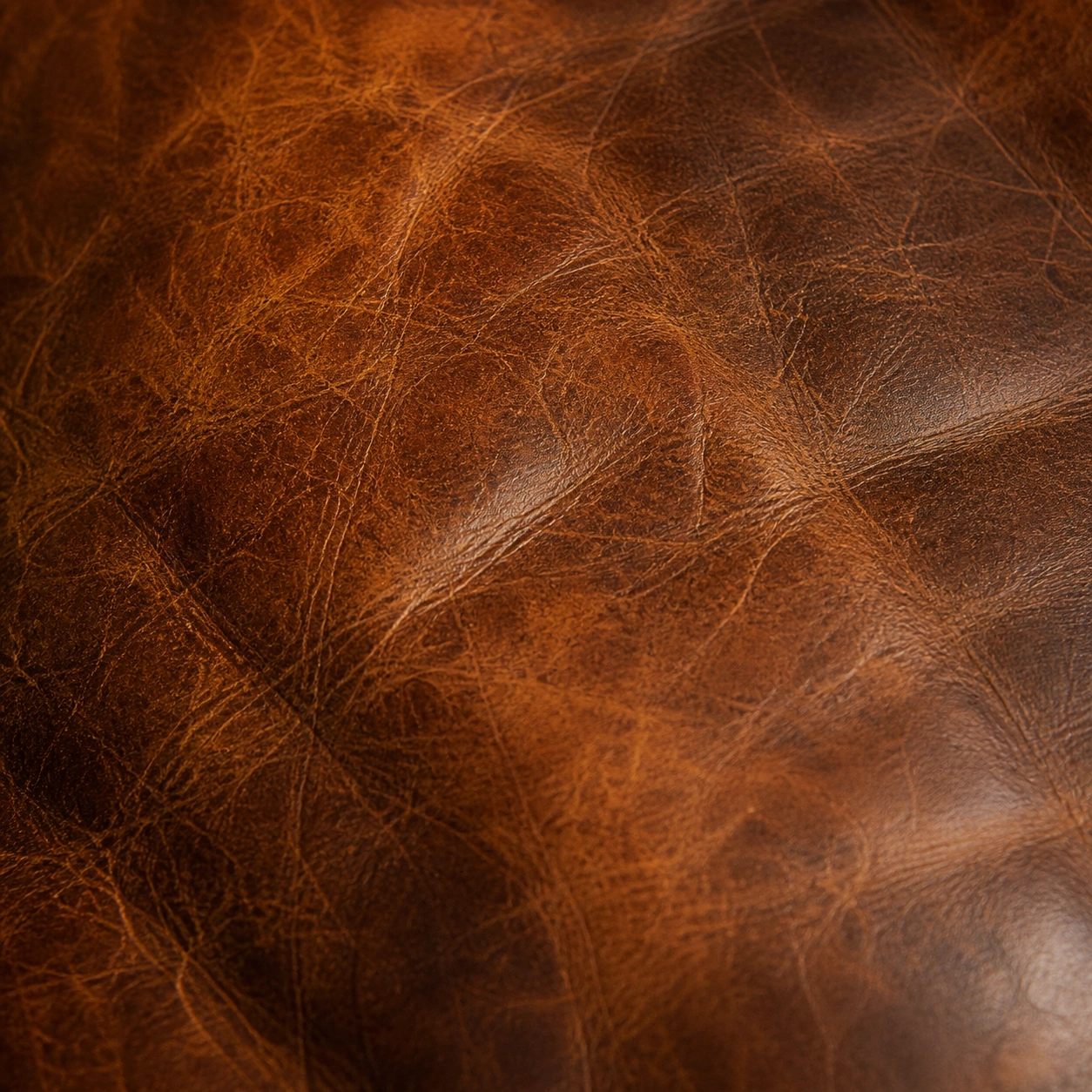 Natural patina on aged vintage leather sofa